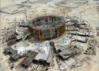 Illustration for article titled Time-Lapse Gallery Of Abu Dhabi's Nearly-Completed Ferrari World Theme Park